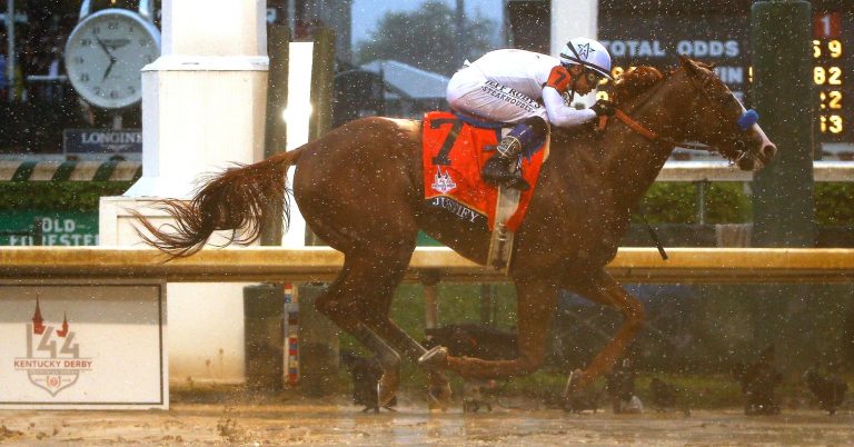 Justify prevails in the rain and mud to claim 144th Kentucky Derby title, breaks 136 year record