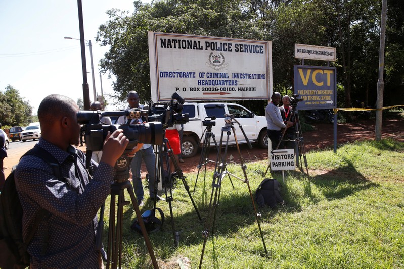 Journalists wait outside the Director of Criminal Investigation headquarters, following the arrest of the head of the National Youth Service Richard Ndubai along with an unspecified number of officials over corruption in Nairobi