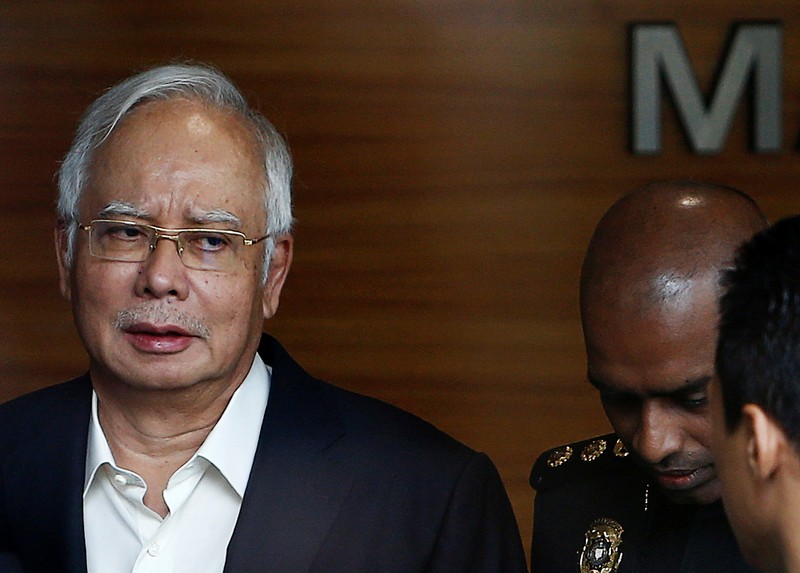 Malaysia's former prime minister Najib Razak arrives to give a statement to the Malaysian Anti-Corruption Commission (MACC) in Putrajaya