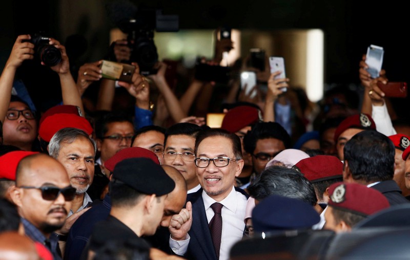 Malaysian politician Anwar Ibrahim leaves a hospital where he is receiving treatment, ahead of an audience with Malaysia's King Sultan Muhammad V, in Kuala Lumpur