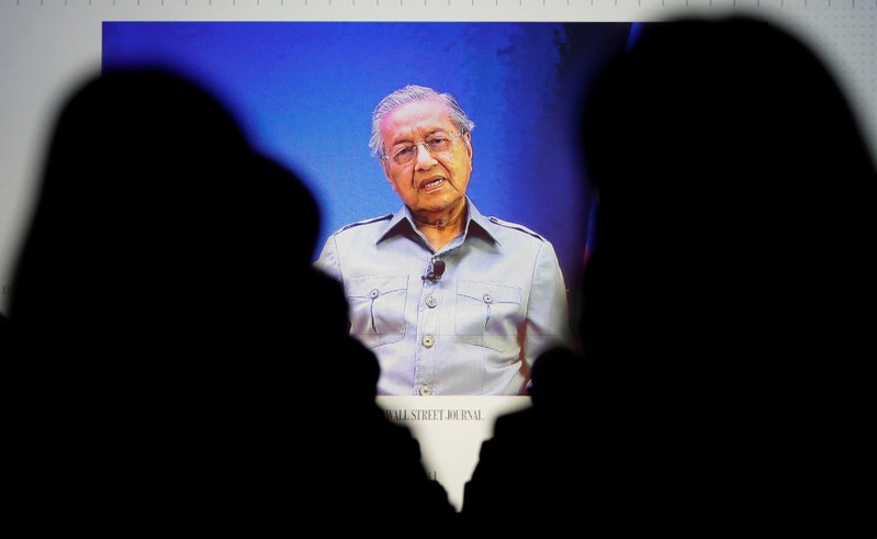 Malaysia's Prime Minister Mahathir Mohamad is seen on video conference screen during the Wall Street Journal CEO Conference in Tokyo