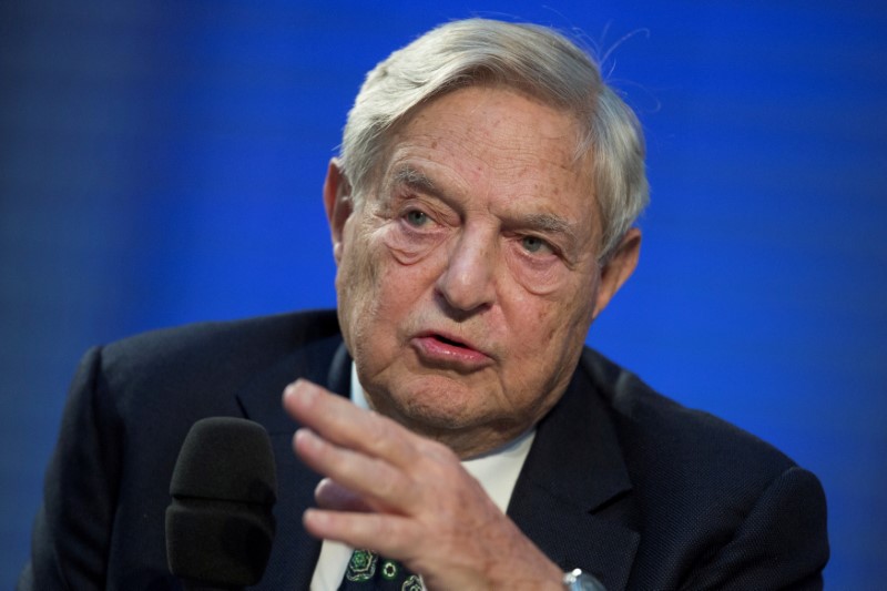 FILE PHOTO: Soros Fund Management Chairman Soros speaks during panel discussion at Nicolas Berggruen Conference in Berlin