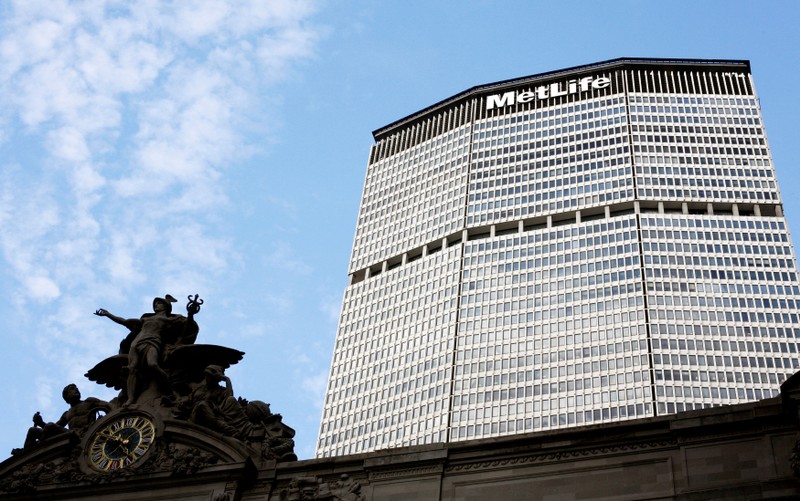 FILE PHOTO: Statue stands atop Grand Central Station in front of the MetLife building in New York
