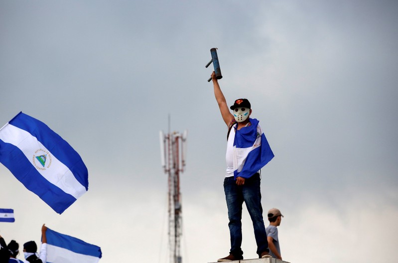 A demonstrator takes part in a protest march against Nicaraguan President Daniel Ortega's government in Managua