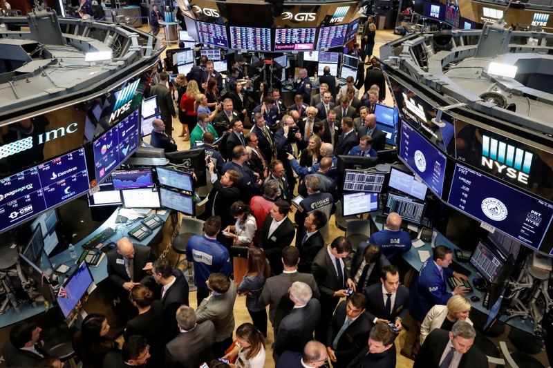 Traders and guests gather for the IPO of PermRock Royalty Trust on the floor of the NYSE in New York