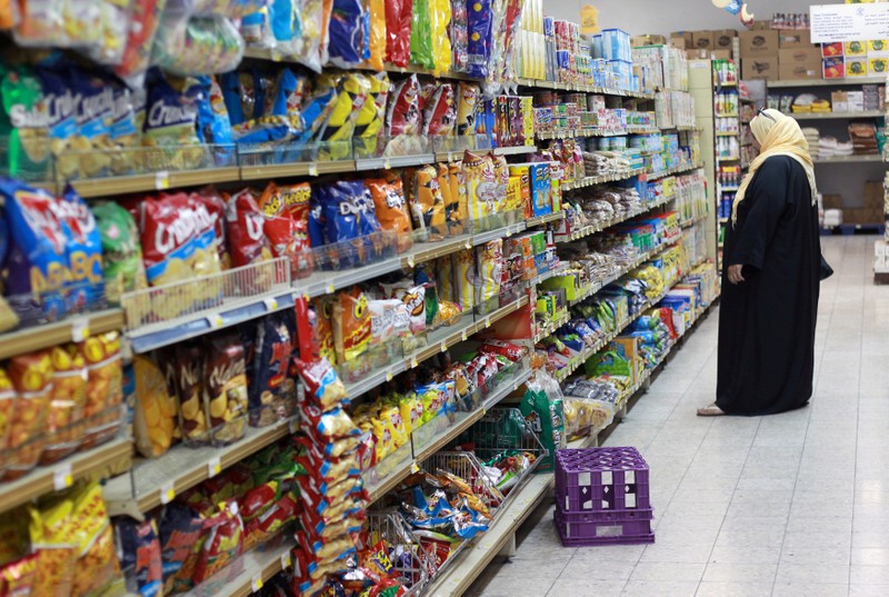 FILE PHOTO: Woman shops in a supermarket in Doha