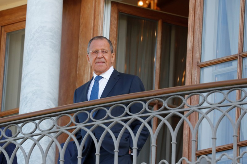 FILE PHOTO: Russian Foreign Minister Lavrov stands on the balcony before a meeting of President Putin with French President Macron in St. Petersburg