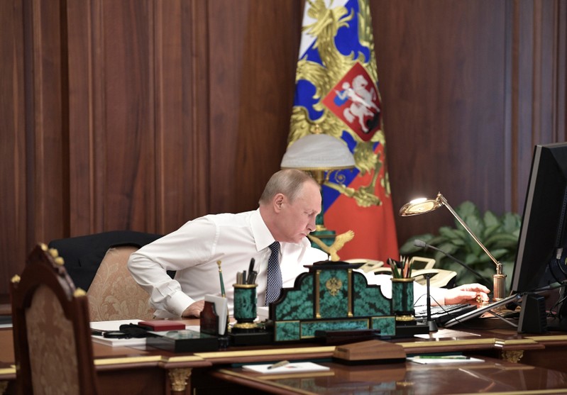 Russian President Putin works in his cabinet before an inauguration ceremony at the Kremlin in Moscow