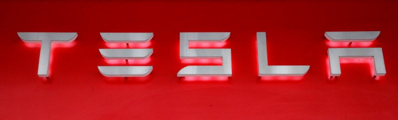 Company logo is seen in front of a showroom of U.S. car manufacturer Tesla in Zurich