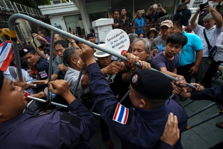 Thai protesters march in Bangkok, police set up barriers