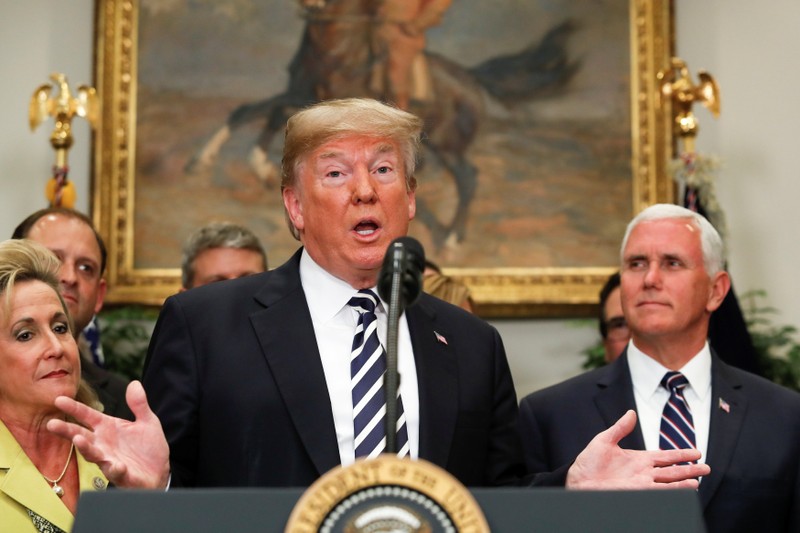 U.S. President Donald Trump gestures as he speaks before the signing ceremony for S. 2155 - Economic Growth, Regulatory Relief, and Consumer Protection Act in the Roosevelt Room at the White House in Washington