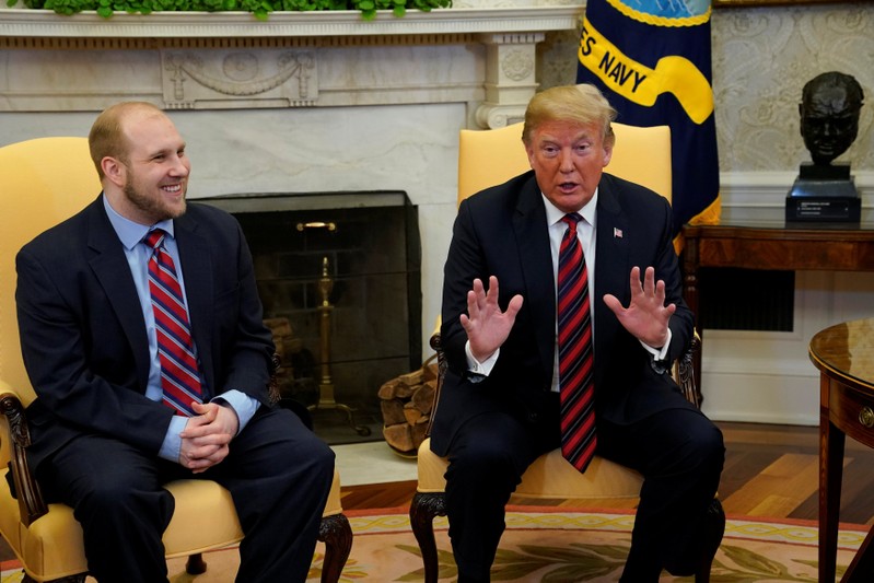 U.S. President Donald Trump talks to the media with Josh Holt, an American missionary who was released by Venezuela, in the Oval Office of the White House in Washington