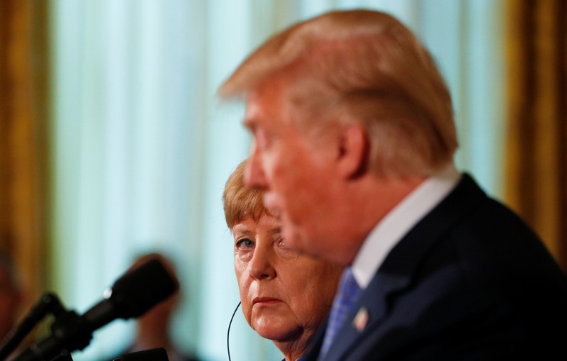 FILE PHOTO: U.S. President Donald Trump and Germany's Chancellor Angela Merkel hold a joint news conference at the White House in Washington