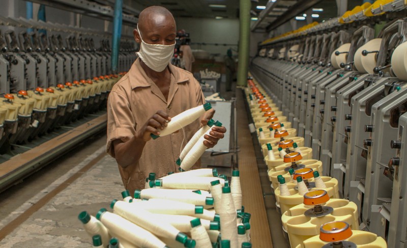 A worker prepares thread at the the Utexrwa garment factory in Kigali