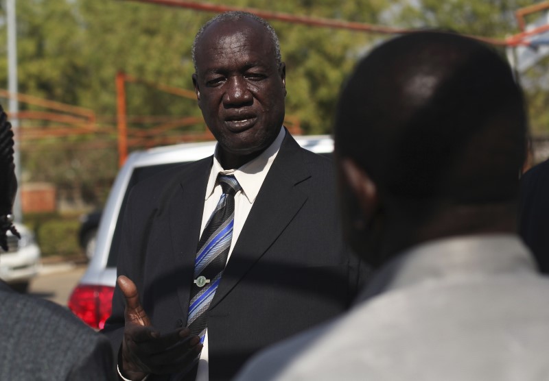 FILE PHOTO - South Sudan's Defence Minister Kuol Manyang Juuk talks to cabinet members after a cabinet meeting in Juba