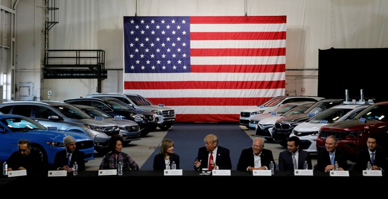 FILE PHOTO: Trump talks with auto industry leaders at the American Center for Mobility in Ypsilanti Township, Michigan