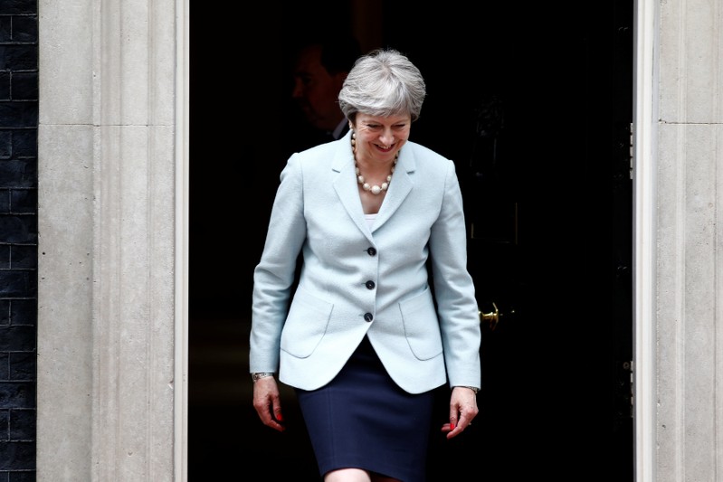 Britain's Prime Minister Theresa May prepares to greet the President of Panama Juan Carlos Varela outside 10 Downing Street, in central London