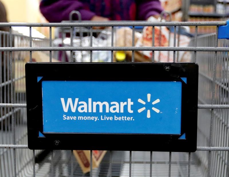 FILE PHOTO: A customer pushes a shopping cart at a Walmart store in Chicago