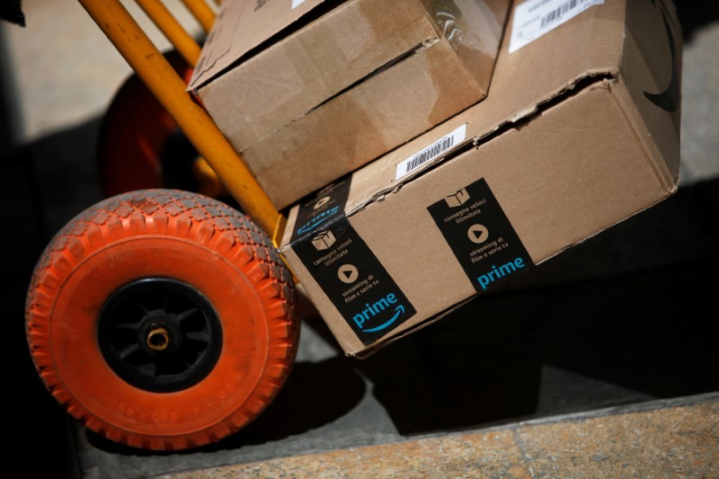 An Amazon box is seen on a cart before being delivered by a Correos Express delivery worker in downtown Ronda