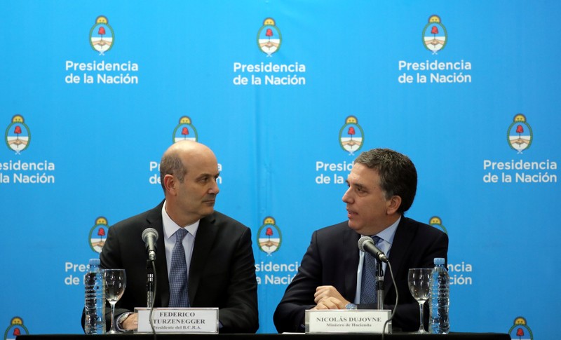 Argentina's Treasury Minister Dujovne and Argentina's Central Bank President Sturzenegger attend a news conference in Buenos Aires