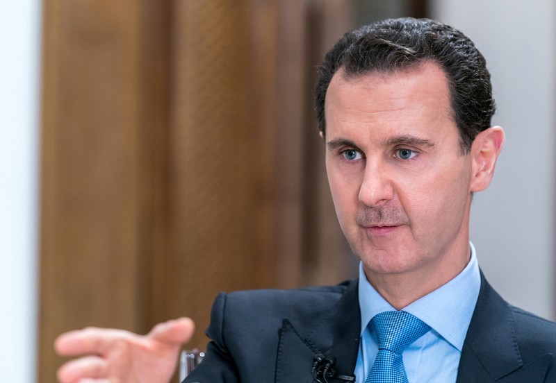 FILE PHOTO: Syrian President Bashar al-Assad gestures during an interview with Iranian channel al-Alam News in Damascus