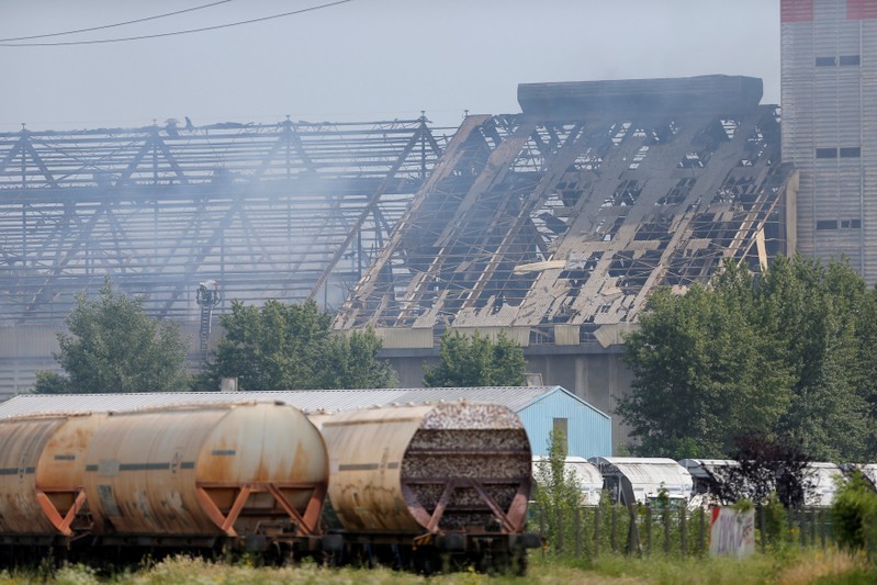 Smoke rises after an explosion at a grain silo that injured several people on the site of the company Silostra, located on the Rhine River port, in Strasbourg
