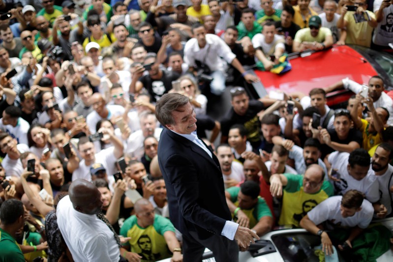 Federal deputy Jair Bolsonaro, a pre-candidate for Brazil's presidential election, is greeted by supporters as he arrives at Luis Eduardo Magalhaes International Airport in Salvador