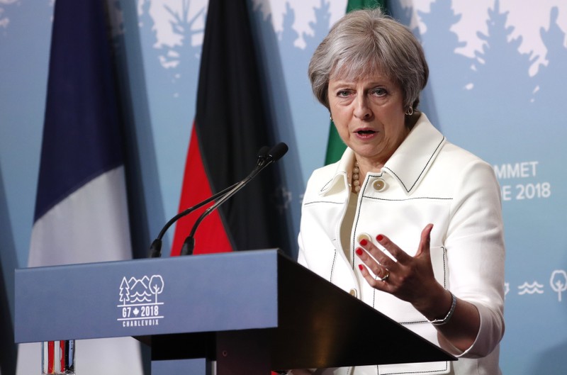 Britain's Prime Minister Theresa May addresses the final news conference of the G7 summit in the Charlevoix city of La Malbaie