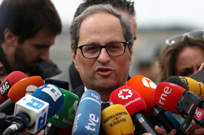 Newly elected Catalan regional leader Quim Torra speaks to reporters outside the Estremera prison in Estremera