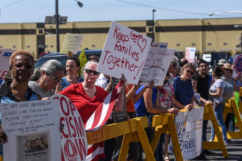 People participate in a protest against recent U.S. immigration policy of separating children from their families when they enter the United States as undocumented immigrants, in front of a Homeland Security facility in Elizabeth