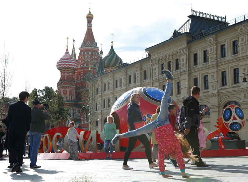 FILE PHOTO: People walk past decorations for the upcoming 2018 FIFA World Cup in central Moscow