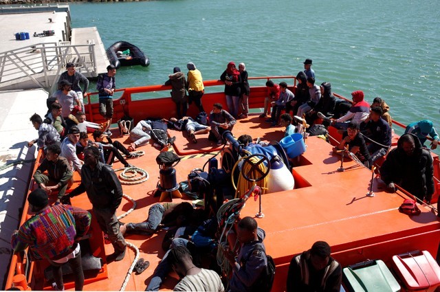 Migrants are seen on a rescue boat after arriving at the port of Barbate