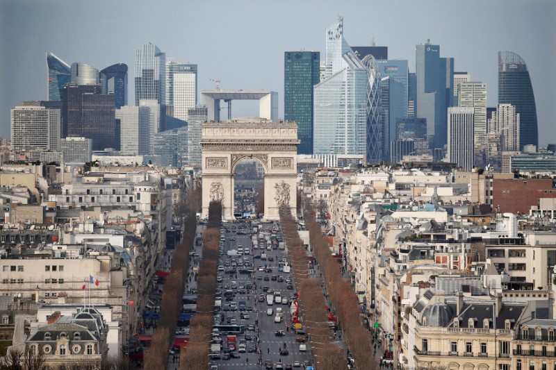 FILE PHOTO: General view of the skyline of La Defense business district behind Paris landmark the Arc de Triomphe and the Champs Elysees avenue