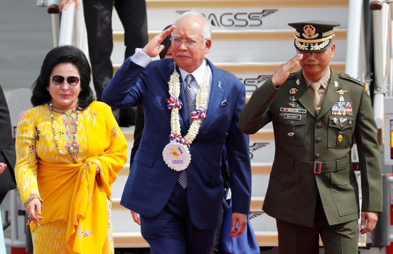 Malaysian PM Razak and his spouse Rosmah Mansor arrive to attend ASEAN Summit and related meetings in Clark, Pampanga