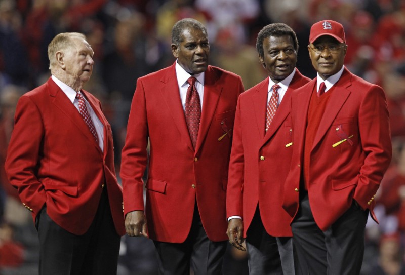 Baseball Hall of Fame members and former St. Louis Cardinals (L-R) Schoendienst, Gibson, Brock and Smith appear on the field before the start of play between the St. Louis Cardinals and the Texas Rangers in Game 6 of MLB's World Series baseball championshi