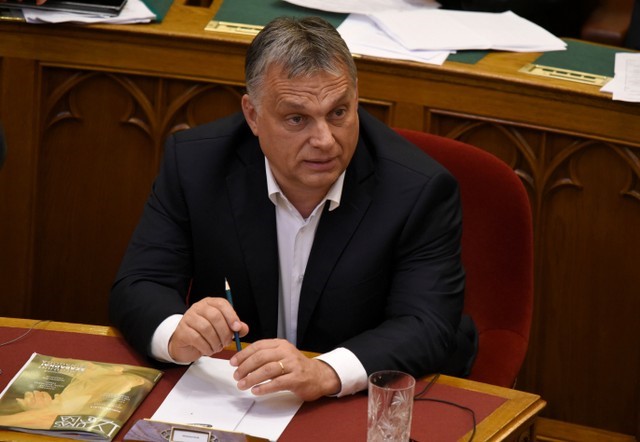 Hungarian Prime Minister Orban sits before vote of the 