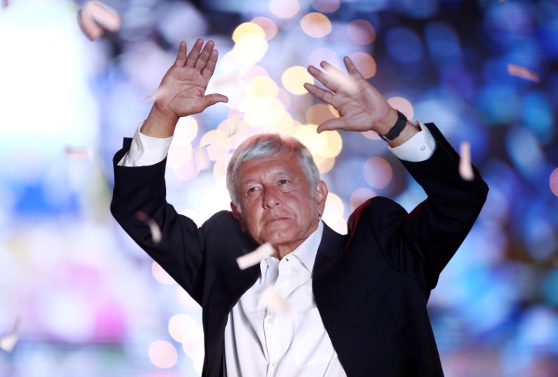 Mexican presidential candidate Andres Manuel Lopez Obrador waves to supporters during his closing campaign rally at the Azteca stadium, in Mexico City