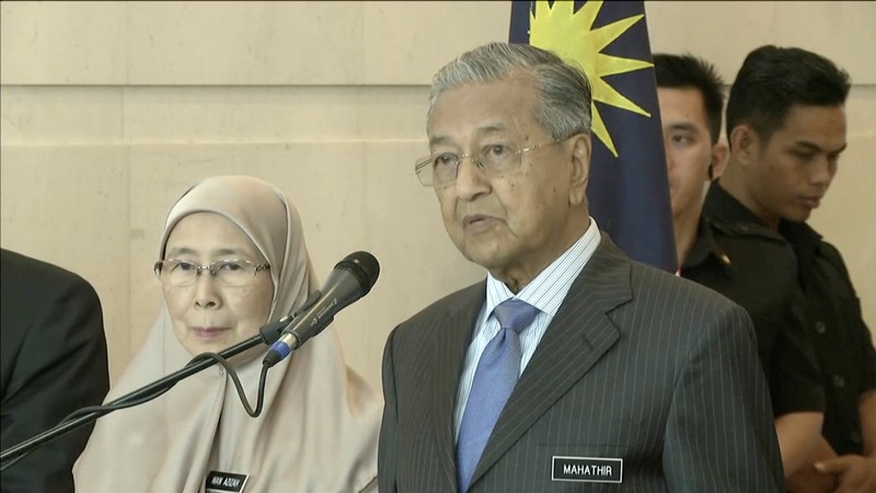 Malaysia's PM Mahathir speaks beside DPM Wan Azizah during a news conference after a weekly cabinet meeting in Putrajaya