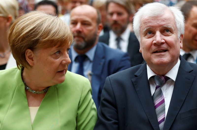 German Chancellor Merkel and German Interior minister Seehofer attend an event to commemorate victims of displacement in Berlin