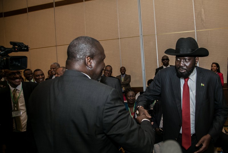 South Sudan President Salva Kiir greets South Sudan Rebel leader Riek Machar during the 32nd Extra-Ordinary Summit of IGAD Assembly of Heads of State and Government in Addis Ababa