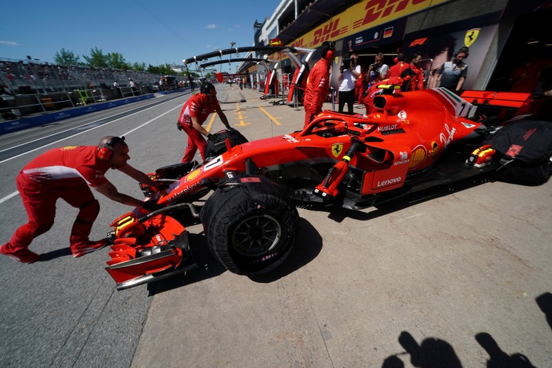 Kimi Raikkonen is pushed back into the garage at Circuit Gilles Villeneuve during a practice session for the F1 race in Montreal