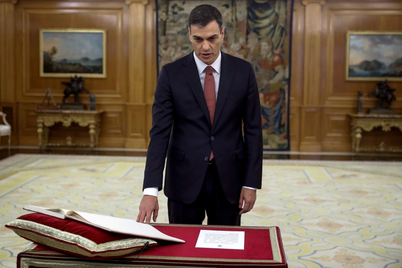 Spain's new Prime Minister and Socialist party (PSOE) leader Pedro Sanchez swears in during a ceremony at the Zarzuela Palace in Madrid