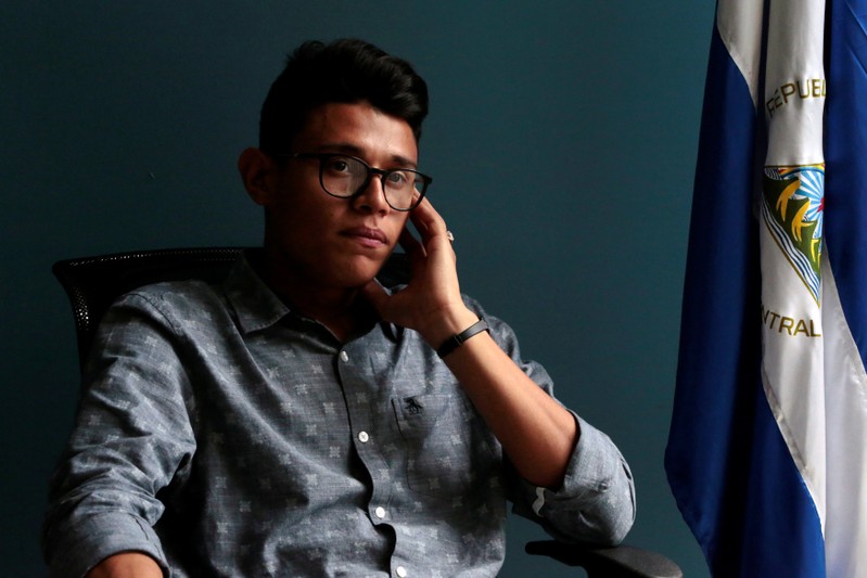 Lesther Aleman, a 20-year old student, poses for a picture at an office in Managua