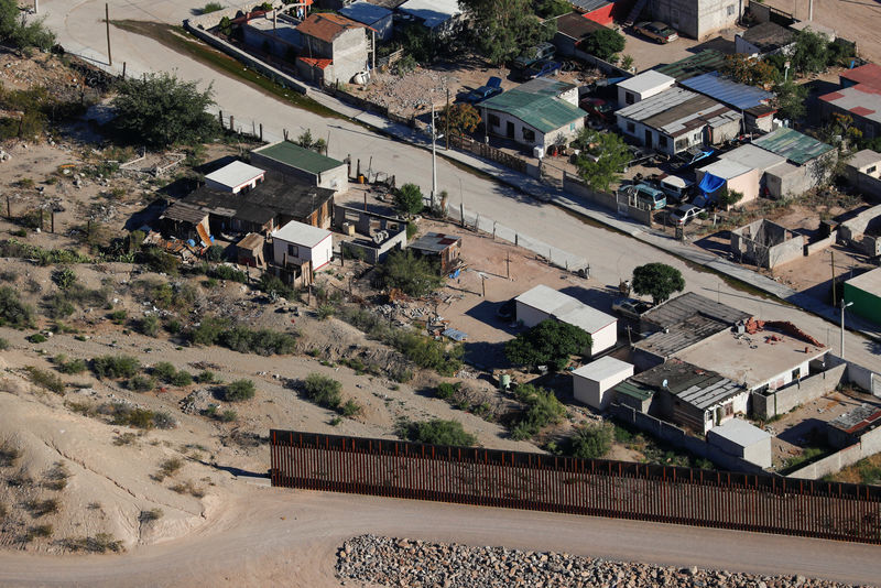 A U.S. border fence between Mexico and the United States ends in the back yard of homes in Juarez, Mexico next to Sunland Park, New Mexico,