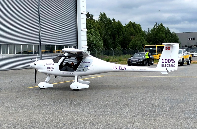 A two-seat electric plane made by Slovenian firm Pipistrel stands outside a hangar before a test flight at Oslo Airport