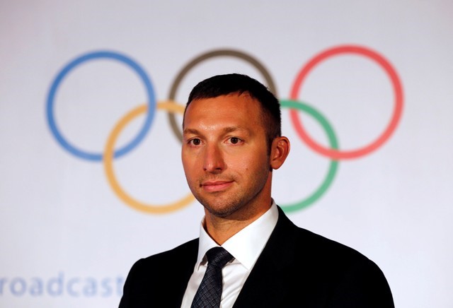 Australian swimmer Ian Thorpe leaves after attending a news conference in Mumbai
