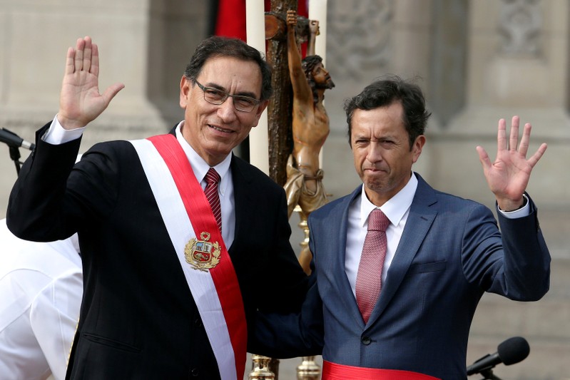 FILE PHOTO: Peru's President Martin Vizcarra and new Finance Minister David Tuesta wave during the swearing-in ceremony at the government palace in Lima, Peru