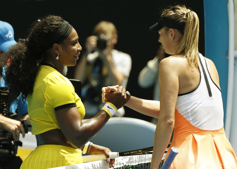 Williams of the U.S. and Russia's Sharapova shake hands after Williams won their quarter-final match at the Australian Open tennis tournament at Melbourne Park