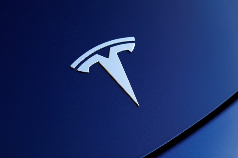 The front hood logo on a 2018 Tesla Model 3 electric vehicle is shown in Cardiff, California