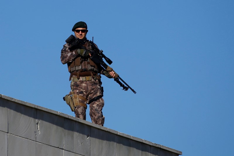 A member of police special forces stands guard during a trial for soldiers accused of attempting to assassinate Turkish President Erdogan on the night of the failed last year's July 15 coup, in Mugla